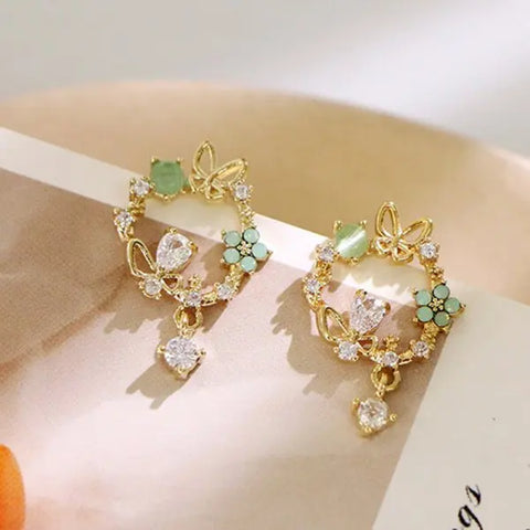 Flower Butterfly Stud: Bling Crystal Studs.